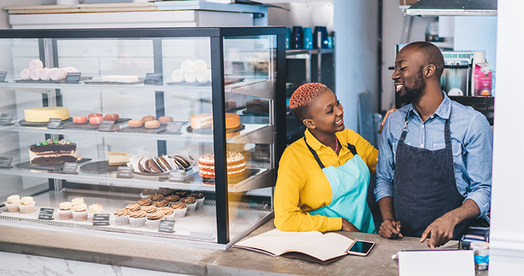 business partners talking in their bakery