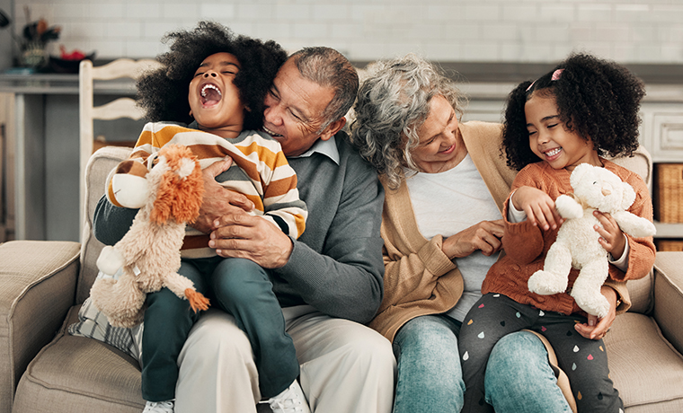 greandparents and grandchildren having fun on the couch